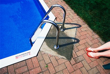 Woman's Legs by Swimming Pool Stock Photo - Premium Royalty-Free, Code: 600-01083066