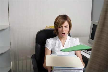 stressful women at the office with piles of work - Businesswoman at Work Stock Photo - Premium Royalty-Free, Code: 600-01083662