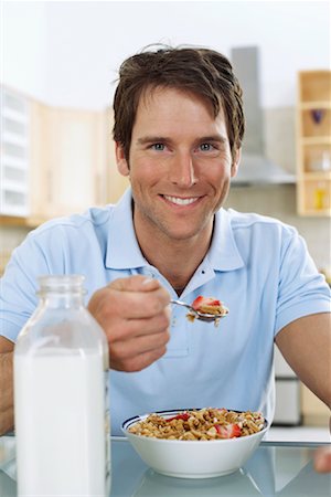 simsearch:700-00592522,k - Man Eating Breakfast Cereal Stock Photo - Premium Royalty-Free, Code: 600-01083832