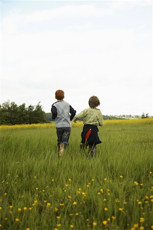 energetic family field - Boys Running in Field Stock Photo - Premium Royalty-Free, Code: 600-01100008