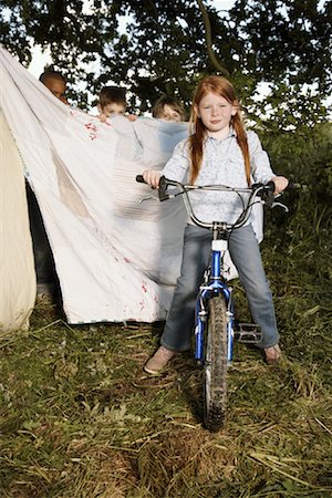 playing in mud - Portrait of Girl on Bicycle Stock Photo - Premium Royalty-Free, Code: 600-01100092