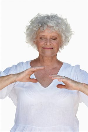 senior woman meditating - Woman Doing Tai Chi Stock Photo - Premium Royalty-Free, Code: 600-01119914