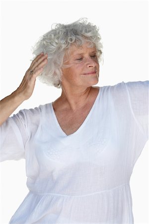 senior woman meditating - Woman Dancing Stock Photo - Premium Royalty-Free, Code: 600-01119916