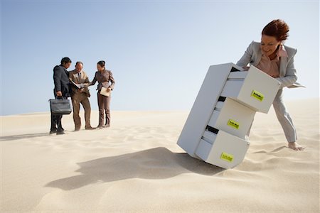 run looking over shoulder - Business People and Filing Cabinet in Desert Stock Photo - Premium Royalty-Free, Code: 600-01110010