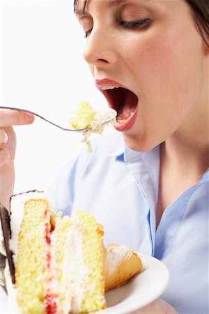 eat mouth closeup - Woman Eating Cake Stock Photo - Premium Royalty-Free, Code: 600-01110044