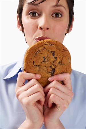 simsearch:600-01110057,k - Woman Holding Cookie Stock Photo - Premium Royalty-Free, Code: 600-01110050