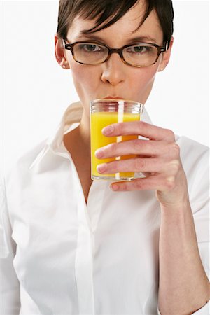 simsearch:600-01110057,k - Woman Drinking Orange Juice Stock Photo - Premium Royalty-Free, Code: 600-01110078