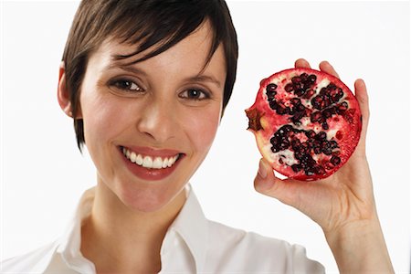 simsearch:600-01110057,k - Woman Holding Pomegranate Stock Photo - Premium Royalty-Free, Code: 600-01110072