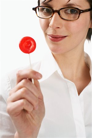simsearch:600-01110057,k - Woman Eating Lollipop Stock Photo - Premium Royalty-Free, Code: 600-01110080