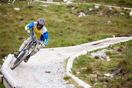 downhill mountain bike - Man Mountain Biking on Bike Path, Aonach Mor, Scotland Stock Photo - Premium Royalty-Free, Code: 600-01110634