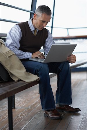 Man Using Laptop Computer Stock Photo - Premium Royalty-Free, Code: 600-01111345
