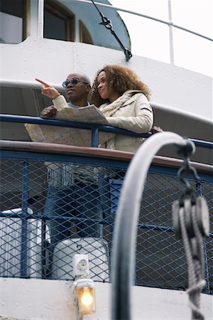 Couple on Ferry Using Map Stock Photo - Premium Royalty-Free, Code: 600-01111404