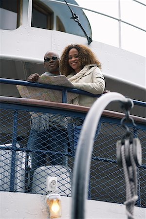 Couple on Ferry Using Map Stock Photo - Premium Royalty-Free, Code: 600-01111405