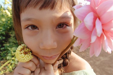 simsearch:700-01072527,k - Close-up of Girl with Flower Stock Photo - Premium Royalty-Free, Code: 600-01111647