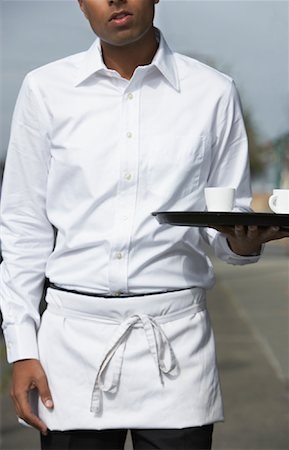 simsearch:600-01235298,k - Waiter Carrying Tray Outdoors Stock Photo - Premium Royalty-Free, Code: 600-01111982