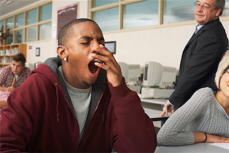 exhausted black teen - Teacher and Students in Classroom Stock Photo - Premium Royalty-Free, Code: 600-01112258