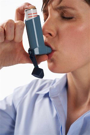 simsearch:600-01110057,k - Woman Using Inhaler Stock Photo - Premium Royalty-Free, Code: 600-01112457