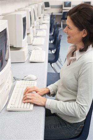 simsearch:600-01112655,k - Woman at Computer in Computer Room Stock Photo - Premium Royalty-Free, Code: 600-01112637