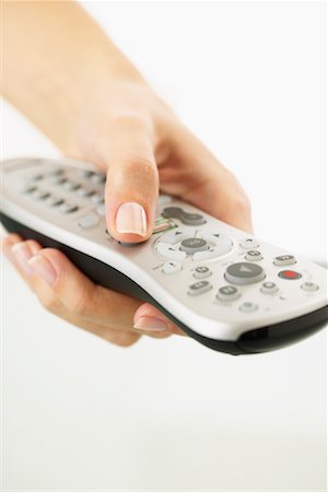 Hand Holding Remote Control Foto de stock - Sin royalties Premium, Código: 600-01112901