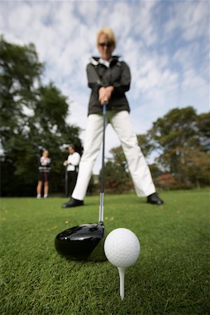 simsearch:600-01112951,k - Woman Golfing Foto de stock - Royalty Free Premium, Número: 600-01112925