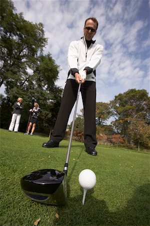 simsearch:600-01112951,k - Man Golfing Foto de stock - Royalty Free Premium, Número: 600-01112926