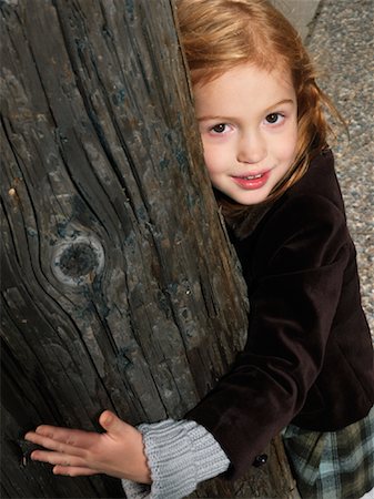 redhead children hug - Portrait of Girl Hugging Tree Stock Photo - Premium Royalty-Free, Code: 600-01124198