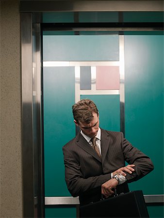 simsearch:600-01494738,k - Businessman in Elevator Stock Photo - Premium Royalty-Free, Code: 600-01124215