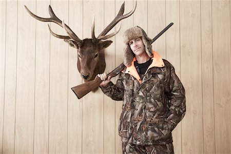 deer and hunter - Portrait de chasseur Photographie de stock - Premium Libres de Droits, Code: 600-01124349