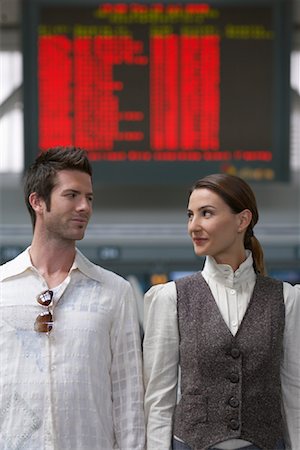 Couple Standing in Airport Fotografie stock - Premium Royalty-Free, Codice: 600-01124869