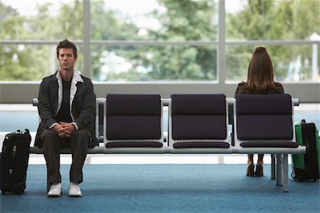 Man and Woman in Airport Waiting Area Stock Photo - Premium Royalty-Free, Code: 600-01124909