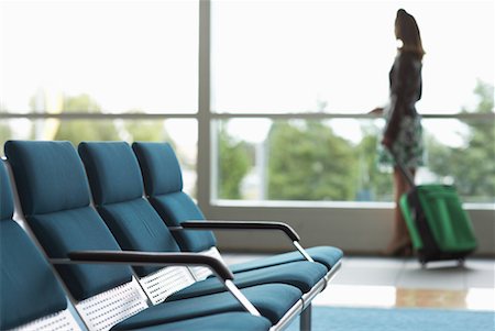 Woman in Airport Waiting Area Stock Photo - Premium Royalty-Free, Code: 600-01124901