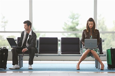Man and Woman in Airport Waiting Area Fotografie stock - Premium Royalty-Free, Codice: 600-01124903