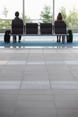 Man and Woman in Airport Waiting Area Fotografie stock - Premium Royalty-Free, Codice: 600-01124912