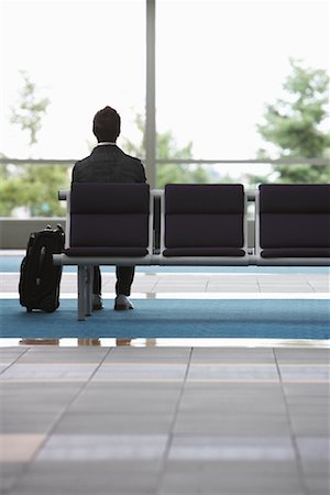 Man in Airport Waiting Area Fotografie stock - Premium Royalty-Free, Codice: 600-01124913