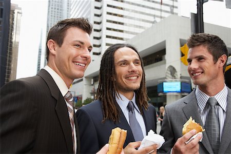 Businessmen Eating Hot Dogs Stock Photo - Premium Royalty-Free, Code: 600-01120101