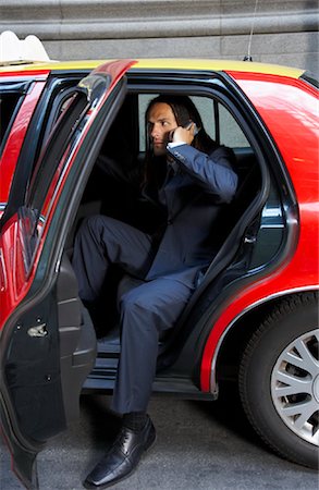 simsearch:600-01275479,k - Businessman Using Cellular Phone in Taxi Stock Photo - Premium Royalty-Free, Code: 600-01120116