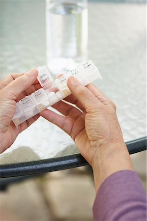 Woman Taking Pills Stock Photo - Premium Royalty-Free, Code: 600-01120252