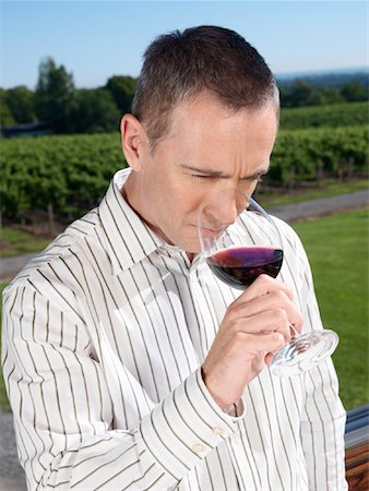 Portrait of Man Tasting Wine Stock Photo - Premium Royalty-Free, Code: 600-01120324