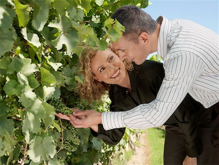 photo of model woman with grapes - Couple at Winery Stock Photo - Premium Royalty-Free, Code: 600-01120348