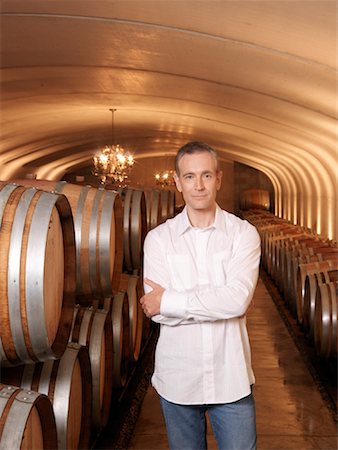 simsearch:700-03018067,k - Man Standing in Wine Cellar Stock Photo - Premium Royalty-Free, Code: 600-01120382