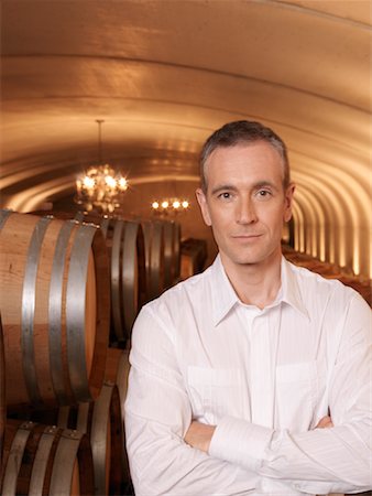 simsearch:600-01120402,k - Man Standing in Wine Cellar Stock Photo - Premium Royalty-Free, Code: 600-01120383