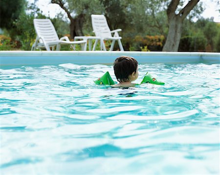 pool kid back - Toddler in Swimming Pool Stock Photo - Premium Royalty-Free, Code: 600-01120624