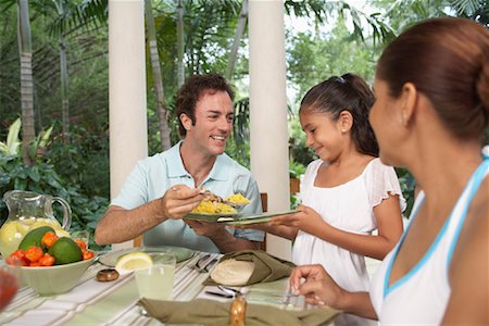 preteen girls at lunch table - Family Eating Dinner Stock Photo - Premium Royalty-Free, Code: 600-01123641