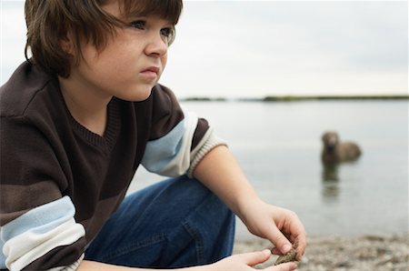 sad pic boy in water - Portrait of Boy on Beach Stock Photo - Premium Royalty-Free, Code: 600-01123684