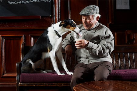 drinking beer pub - Man With Dog in Pub Stock Photo - Premium Royalty-Free, Code: 600-01123759