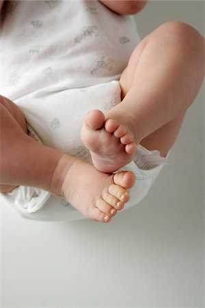 simsearch:700-02686511,k - Baby's Feet Fotografie stock - Premium Royalty-Free, Codice: 600-01123996