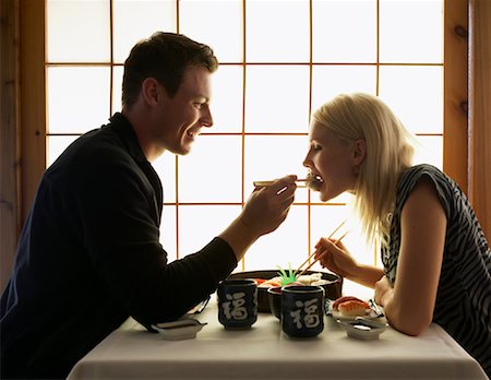 sushi plate - Couple in Japanese Restaurant Stock Photo - Premium Royalty-Free, Code: 600-01164290