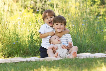 Portrait of Three Brothers Outdoors Stock Photo - Premium Royalty-Free, Code: 600-01163558