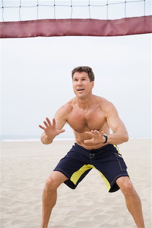 simsearch:6109-06195368,k - Man Playing Volleyball Stock Photo - Premium Royalty-Free, Code: 600-01172449