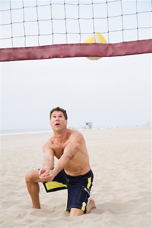 Man Playing Volleyball Stock Photo - Premium Royalty-Free, Code: 600-01172450